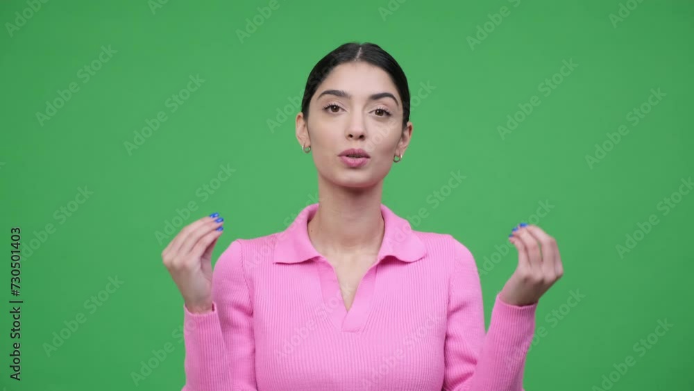 Happy young woman vlogger talking on green background. Greeting to audience, recording video blog, conducting broadcast, social media life. Happy young woman vlogger talking on green background. Greeting to audience, recording video blog, conducting broadcast, social media life.