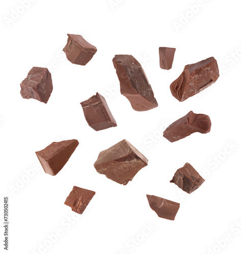 Foto Tasty chocolate chunks falling on white background