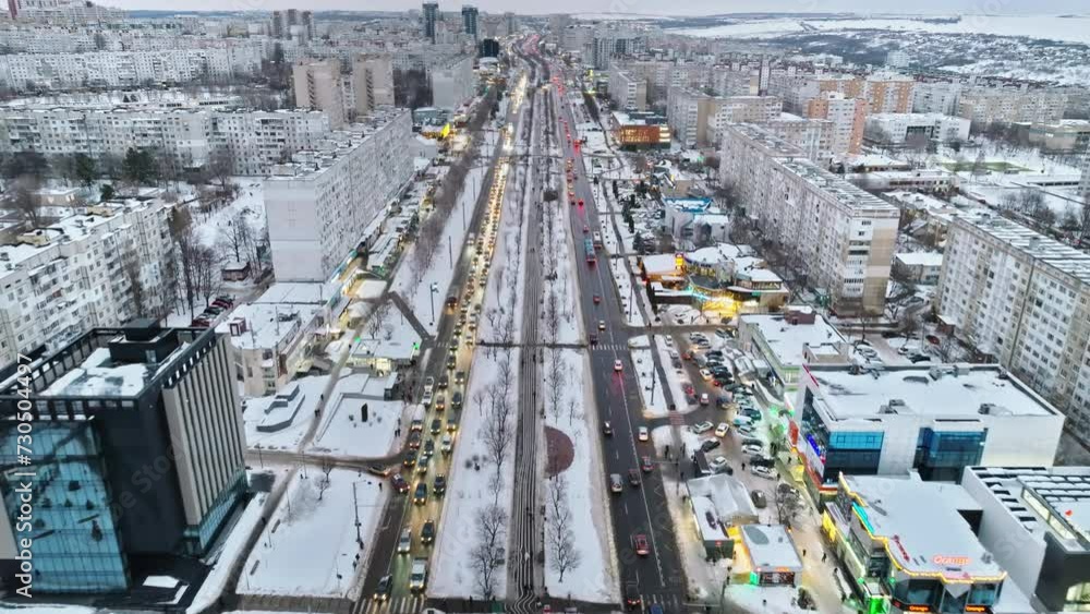 Aerial drone view of Chisinau city covered in snow with moving traffic. Winter in Moldova Aerial drone view of Chisinau city covered in snow with moving traffic. Winter in Moldova