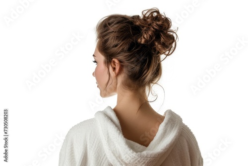 Back view of a gorgeous woman in a bathrobe against a white background