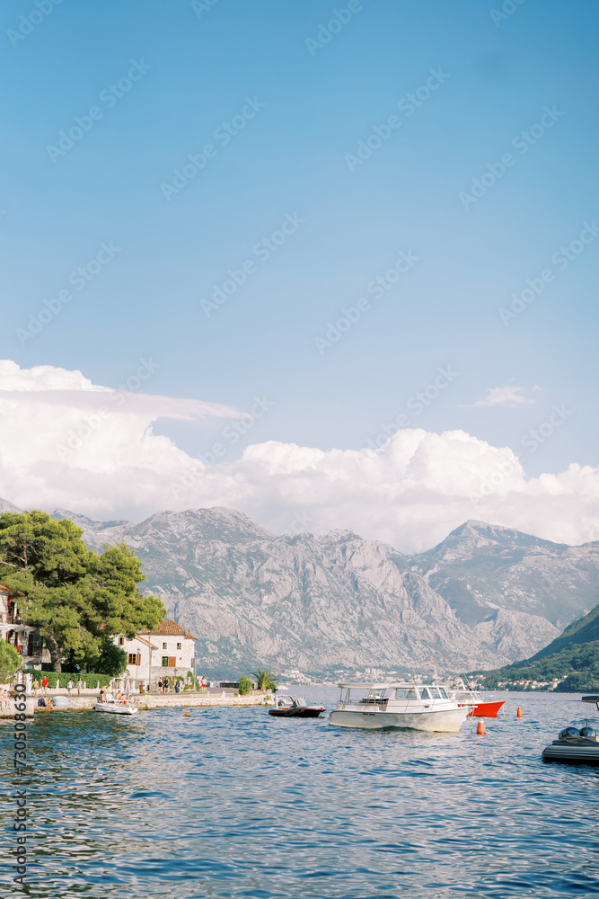 Boats are moored off the coast of Perast. Montenegro