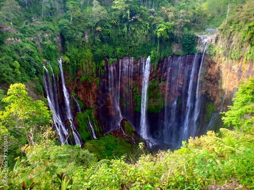 "Embark on a Journey of Natural Wonder at Tumpak Sewu Waterfall. Located in East Java, Indonesia, Tumpak Sewu, also known as the 'Thousand Waterfalls.