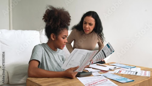 Stressed African American women has financial problems with credit card debt to pay crucial show concept of bad personal money and mortgage pay management crisis. photo