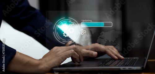 Business person using laptop computer connecting internet online loading file from virtual digital data server. Technology and innovation concept.