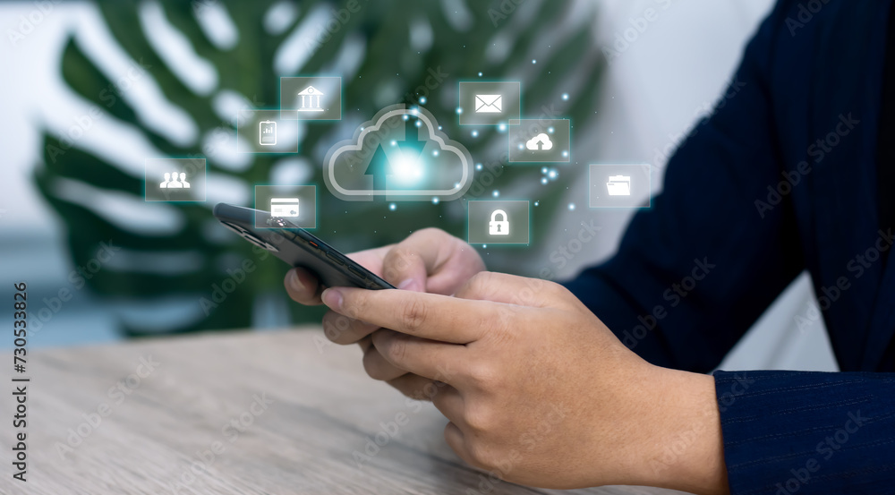 Obraz premium Business person using laptop computer notebook access to virtual digital cloud storage database to download file and data.