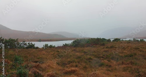 Panorama of the Glenveagh National Park, Ireland on a foggy day. photo