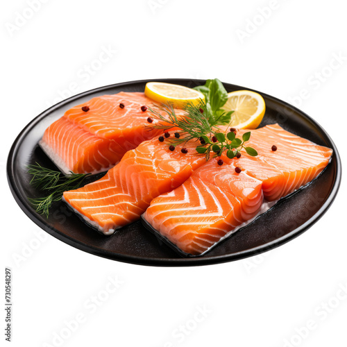 Salmon fillet dish garnished with lemon and pepper on an isolated background