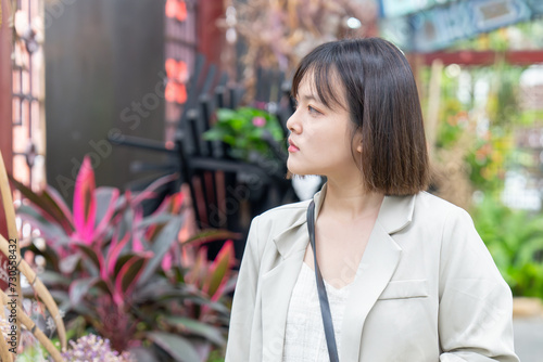 台湾台北市士林区の大きな公園で２０代の若い台湾人女性が散歩する風景 A young Taiwanese woman in her 20s taking a walk in a big park in Shilin District, Taipei City, Taiwan photo