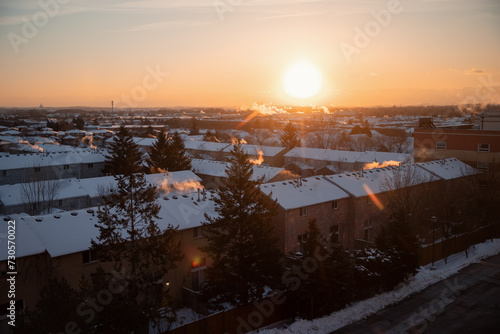 Sunrise over the roofs in winter