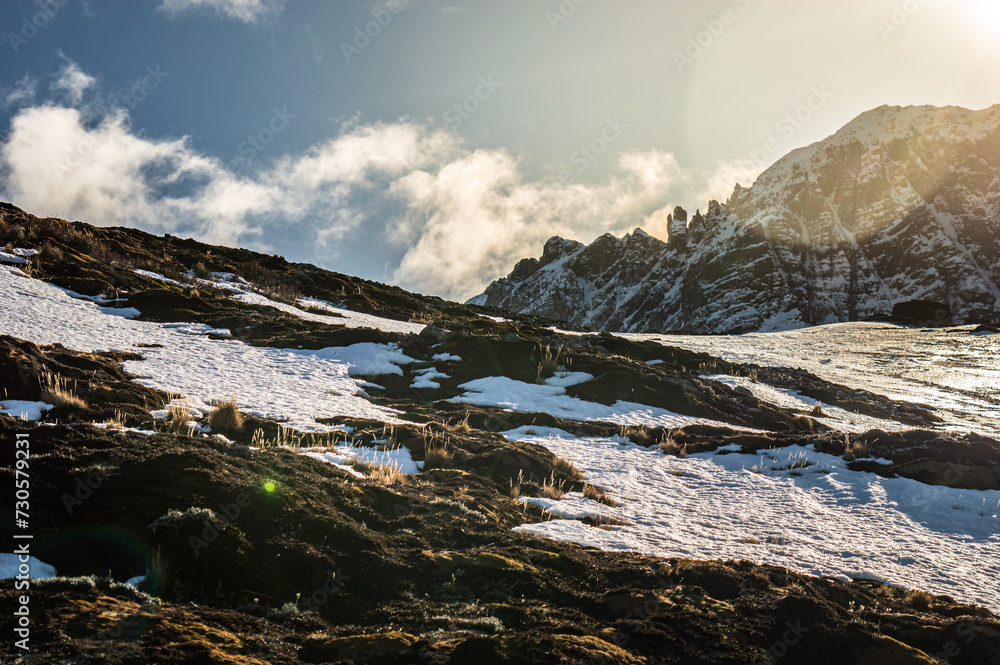 Sun setting behind the mountain of the Andes mountain range. Ushuaia