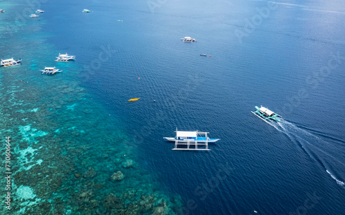 Panorama with a aerial top view as perspective of the Sumilon island beach landing near Oslob, Cebu, Philippines. © SASITHORN