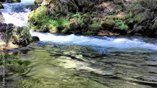 mountain creek streaming clear colorful water