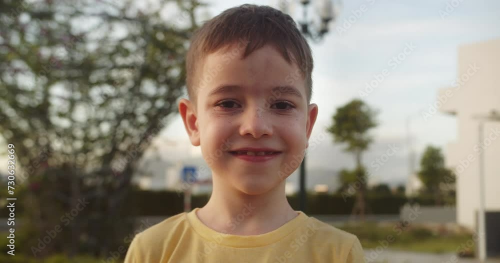 Happy child in rays of the sun. Little boy face in park close-up. Happy face of child in rays of sun. Cute child smiles at camera. Boy dream. Face close-up. Happy child in park. Handsome boy face Happy child in rays of the sun. Little boy face in park close-up. Happy face of child in rays of sun. Cute child smiles at camera. Boy dream. Face close-up. Happy child in park. Handsome boy face