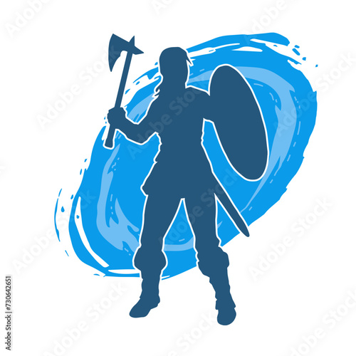 Silhouette of a sexy female warrior in battle armor carrying axe weapon and iron shield.
