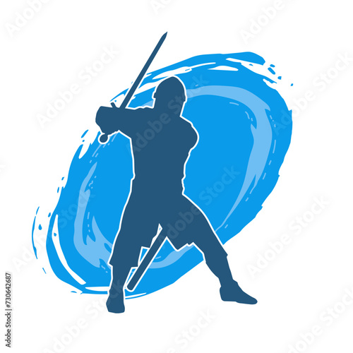 Silhouette of a male warrior wearing war armor suit in action pose using a sword weapon.