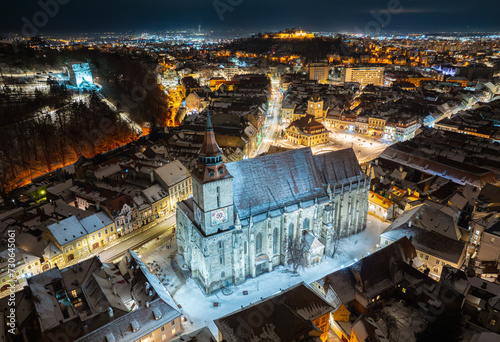 Brasov from above. Winter night aerial photo with this beautiful city from Transylvania, Romania, view to Sfatului Square and Black Church (Piata Sfatului si Biserica Neagra in Romanian language). photo