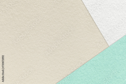 Texture of craft light beige color paper background with white, green and mint border. Vintage abstract cardboard.