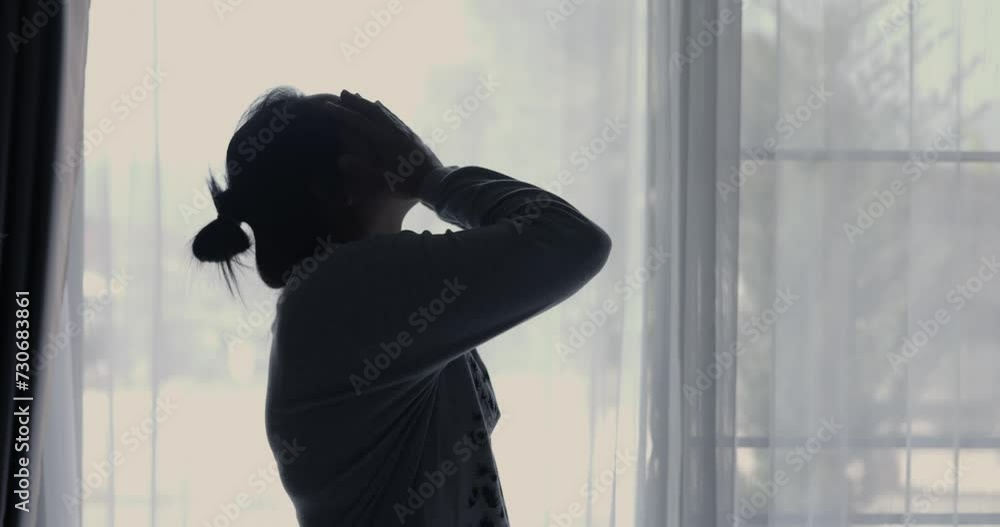 Atmosphere of depression, Trouble in relationship, death in the family. Sad young woman in the living room of her home, Covering face with hands. Dramatic bad news cinematic slow motion moment. Atmosphere of depression, Trouble in relationship, death in the family. Sad young woman in the living room of her home, Covering face with hands. Dramatic bad news cinematic slow motion moment.