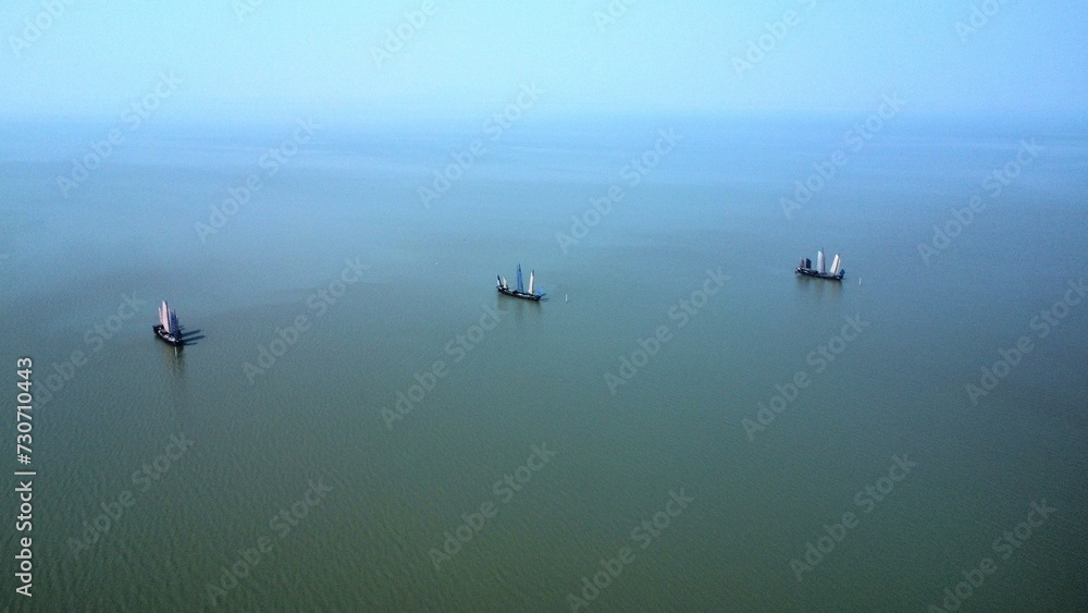 Fototapeta premium Fishing in the lake by boat, trade by boat