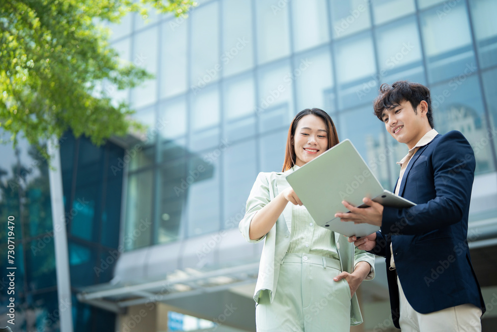 Photo of two young Asian businesspeople Photo of two young Asian businesspeople
