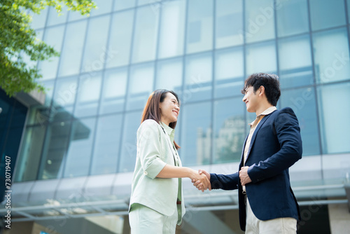 Photo of two young Asian businesspeople
