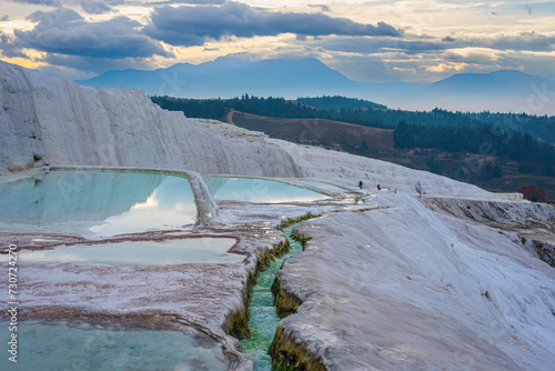Travertines of Pamukkale in winter. Turkish famous white thermal bath with healthy clear water