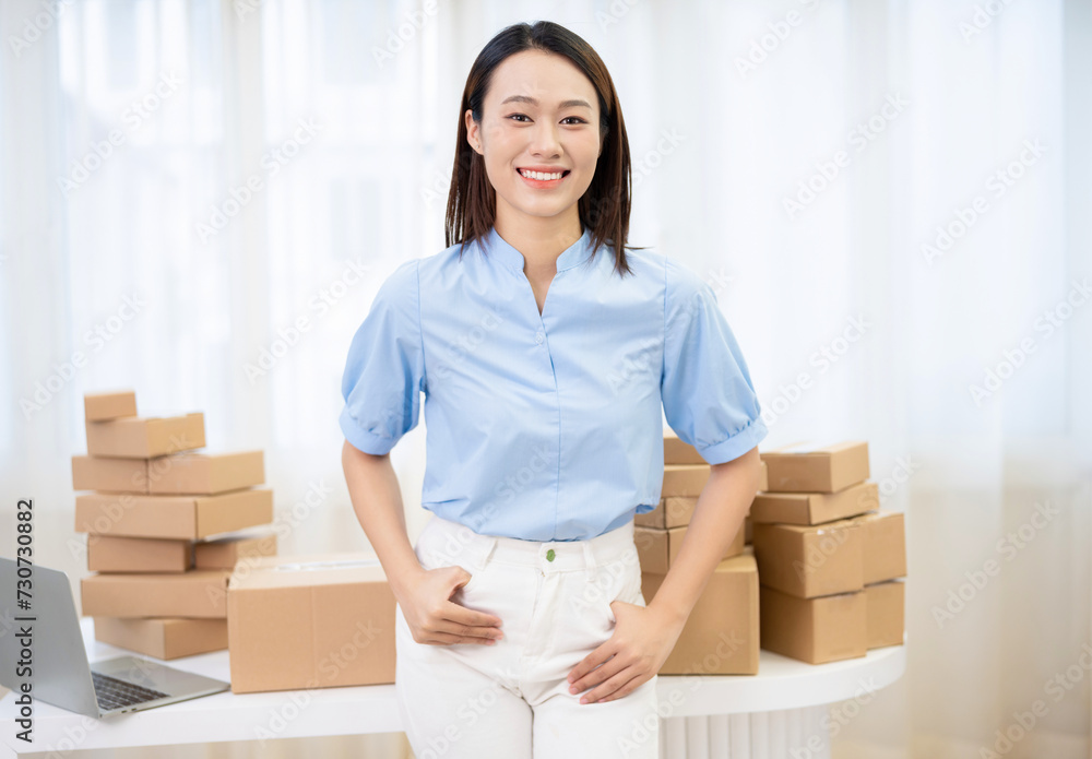 Photo of young Asian woman selling online Photo of young Asian woman selling online