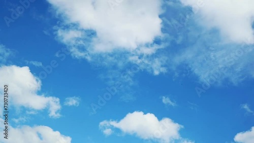 Clouds moving on the blue sky. Timelapse