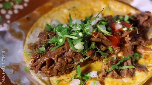 slow motion slider of beef birria taco. Mexican food