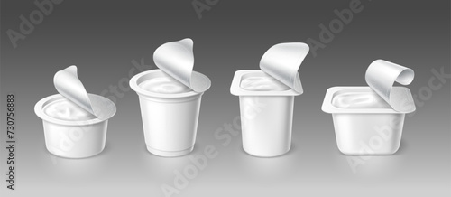 Open yogurt cups, realistic yoghurt container package mockup. Vector 3d visual representation of cream dairy product packaging with an exposed foil lids, cans for presentation and design evaluation photo