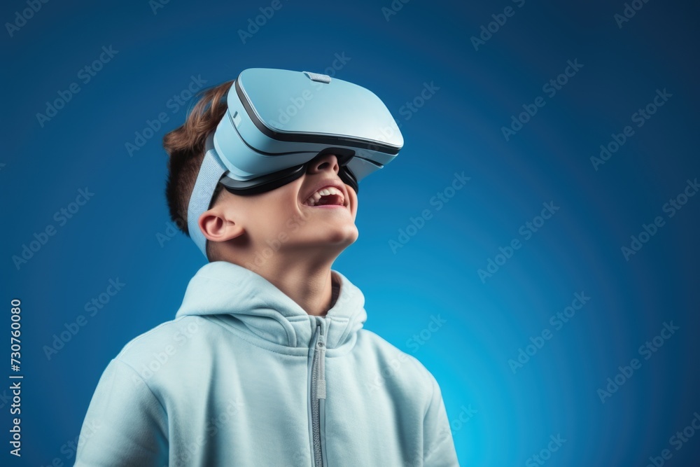A young boy is seen wearing a virtual reality headset. This image can be used to depict the concept of virtual reality technology and its impact on children A young boy is seen wearing a virtual reality headset. This image can be used to depict the concept of virtual reality technology and its impact on children