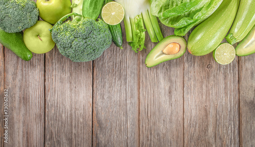 fresh green vegetables on a wooden background. top view. copy space