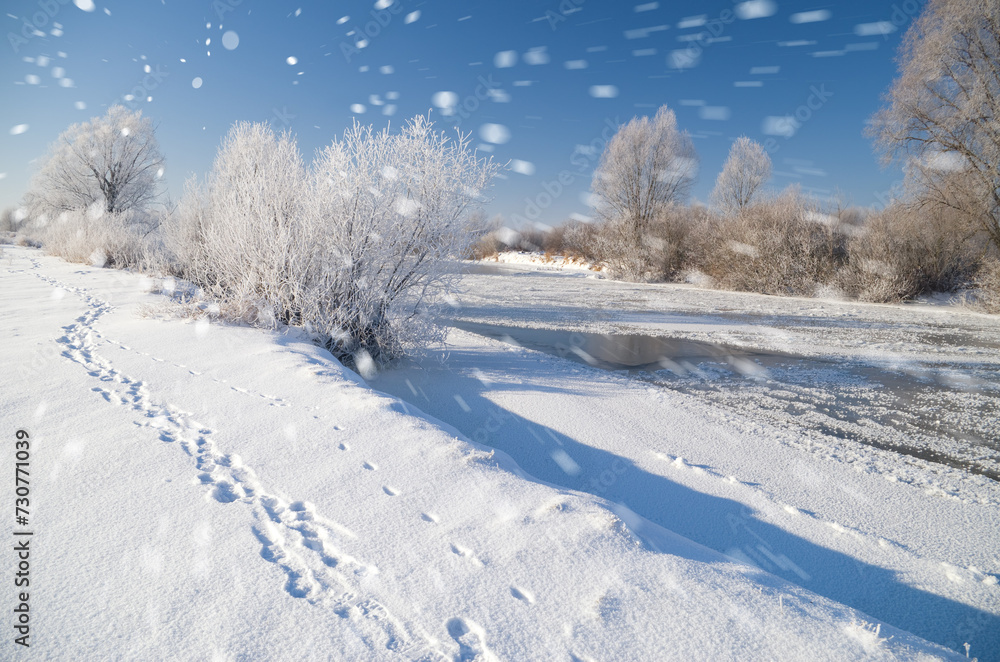 snowfall over the winter river snowfall over the winter river