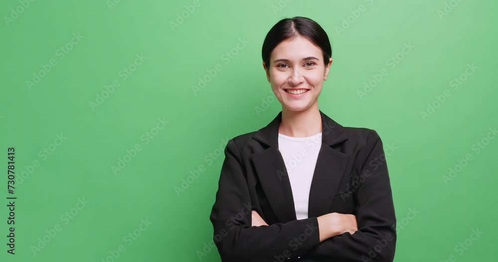 Portrait of attractive businesswoman in a suit. Isolated on green background in studio. Portrait of attractive businesswoman in a suit. Isolated on green background in studio.
