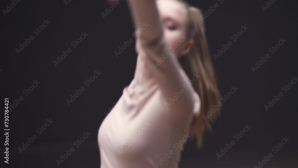 Handheld, young woman dance in a mirror room, flexible girl performs a stretching dance, soft focus. Handheld, young woman dance in a mirror room, flexible girl performs a stretching dance, soft focus.