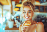 Photo of attractive woman happy with donut