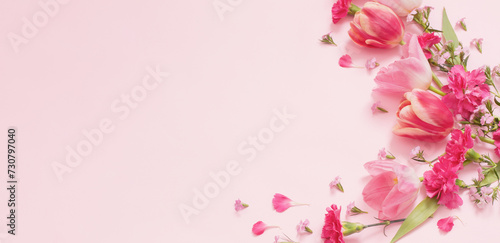 beautiful spring flowers on pink background