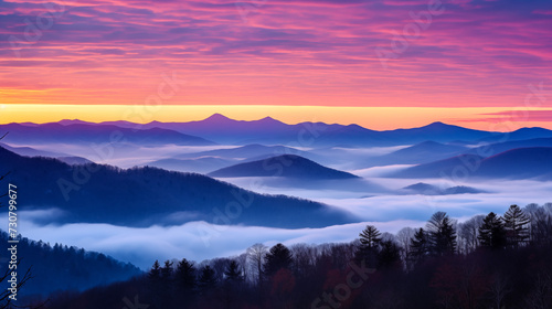 A frosty January sunrise over a mountain range, with hues of pink and orange in the sky © XaMaps