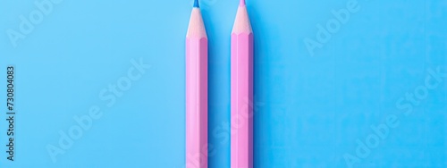 Against a backdrop of serene blue, a colorful lineup of pencils creates a striking visual, promising endless possibilities for artistic expression.