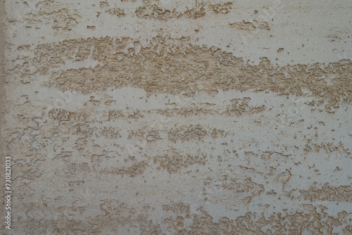 Closeup of beige semi-smooth wall with stucco lace finish