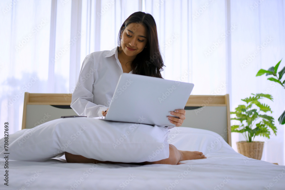 Young woman wake up and work at bedroom. Young woman wake up and work at bedroom.