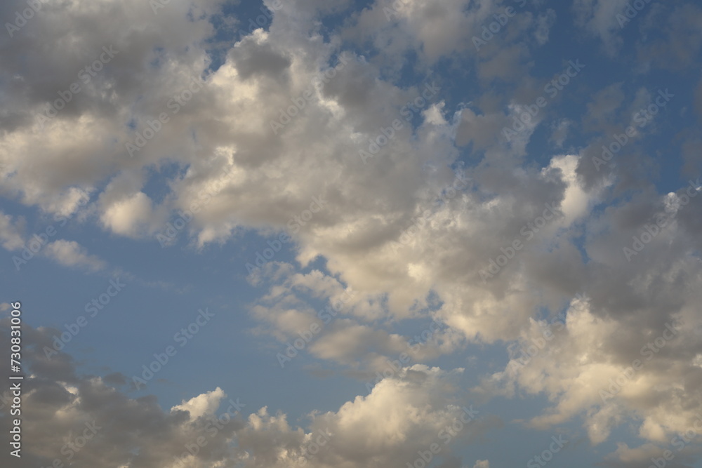 Fototapeta premium Scenic panoramic view with sunrise over the sea. Time lapse of clouds over the mountains. Natural beauty of sky and fluffy morning clouds.