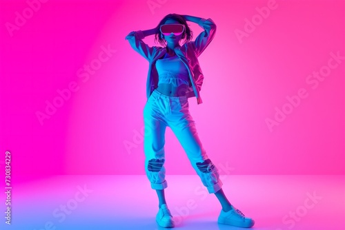 Stylish young woman in denim posing with neon pink and blue lights, modern fashion concept.