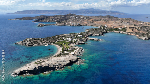 Aerial drone photo of paradise secluded beach and bay of Agios Vasileios located in long peninsula of small island of Schoinousa, Small Cyclades, Greece