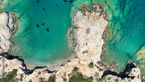 Aerial drone photo of paradise secluded beach of Agios Petros located in long peninsula of small island of Schoinousa, Small Cyclades, Greece photo