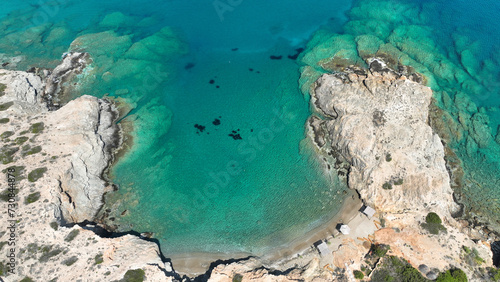 Aerial drone photo of paradise secluded beach of Agios Petros located in long peninsula of small island of Schoinousa, Small Cyclades, Greece