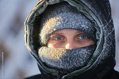 Person Withbfrost on eyelashes Snow-Covered Hood