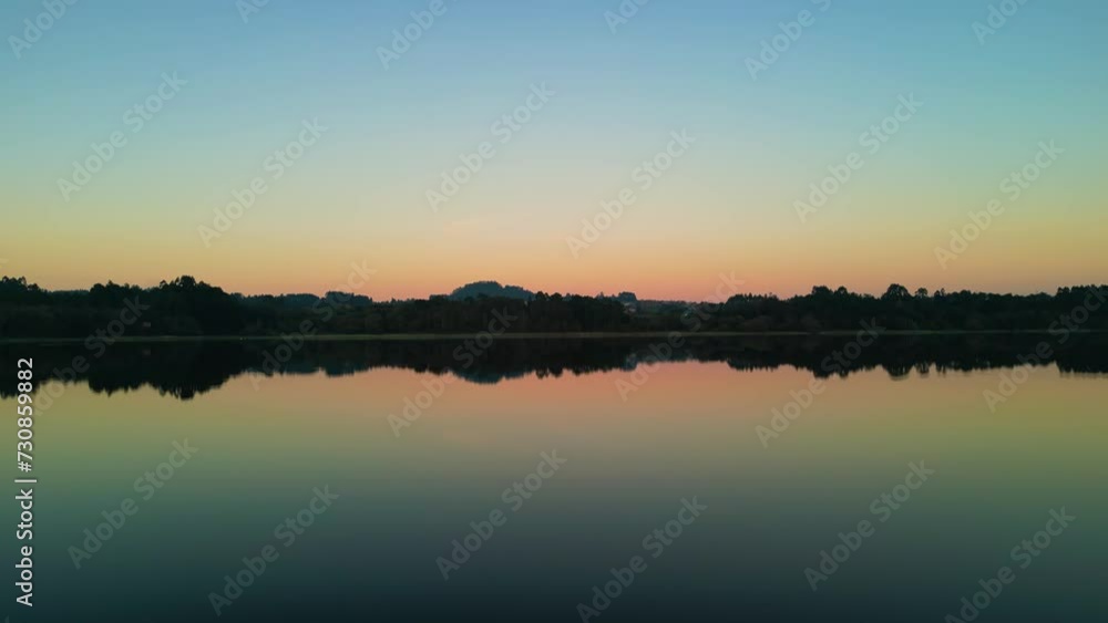 Scene of the Cecebre reservoir lake reflecting the trees around at sunset, Spain Scene of the Cecebre reservoir lake reflecting the trees around at sunset, Spain