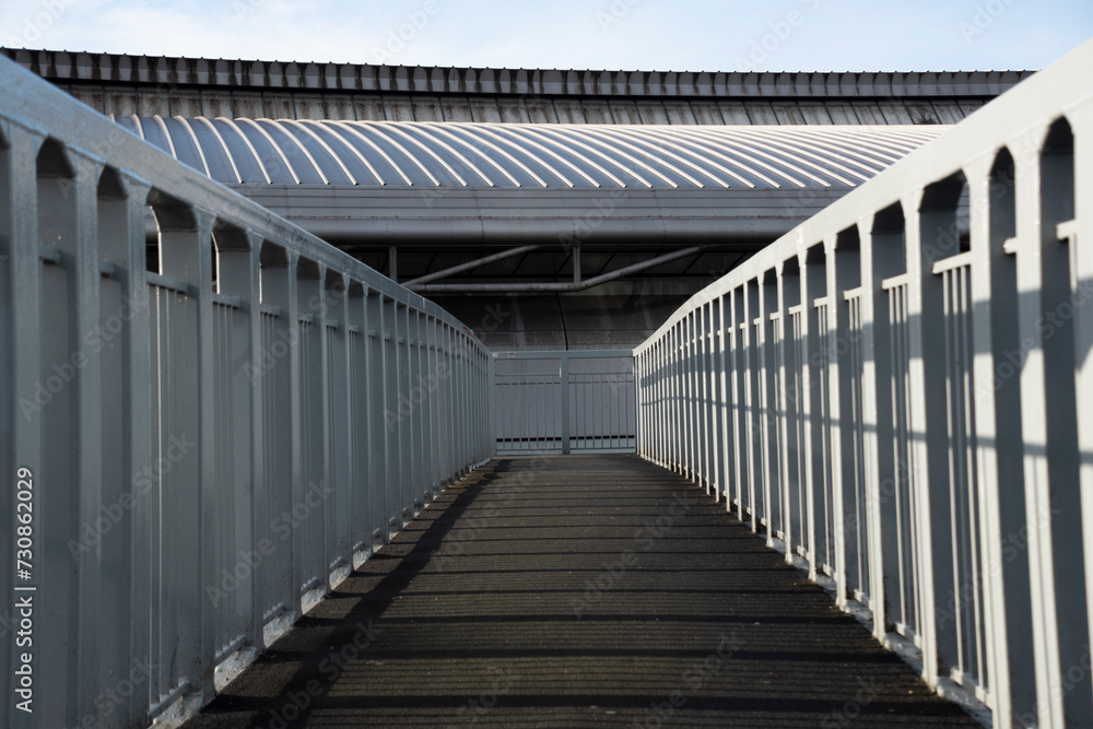 Yorkshire, UK – 21 Dec 2020: A Symmetry on a Pedestrian footbridge on a bright December day, Sheffield UK Yorkshire, UK – 21 Dec 2020: A Symmetry on a Pedestrian footbridge on a bright December day, Sheffield UK