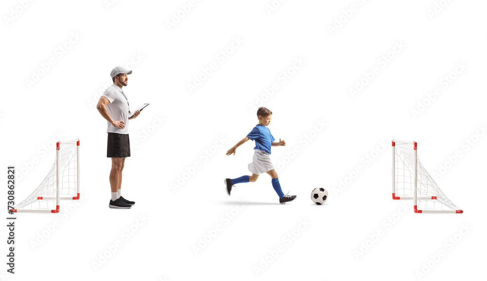 Boy with a coach at football training